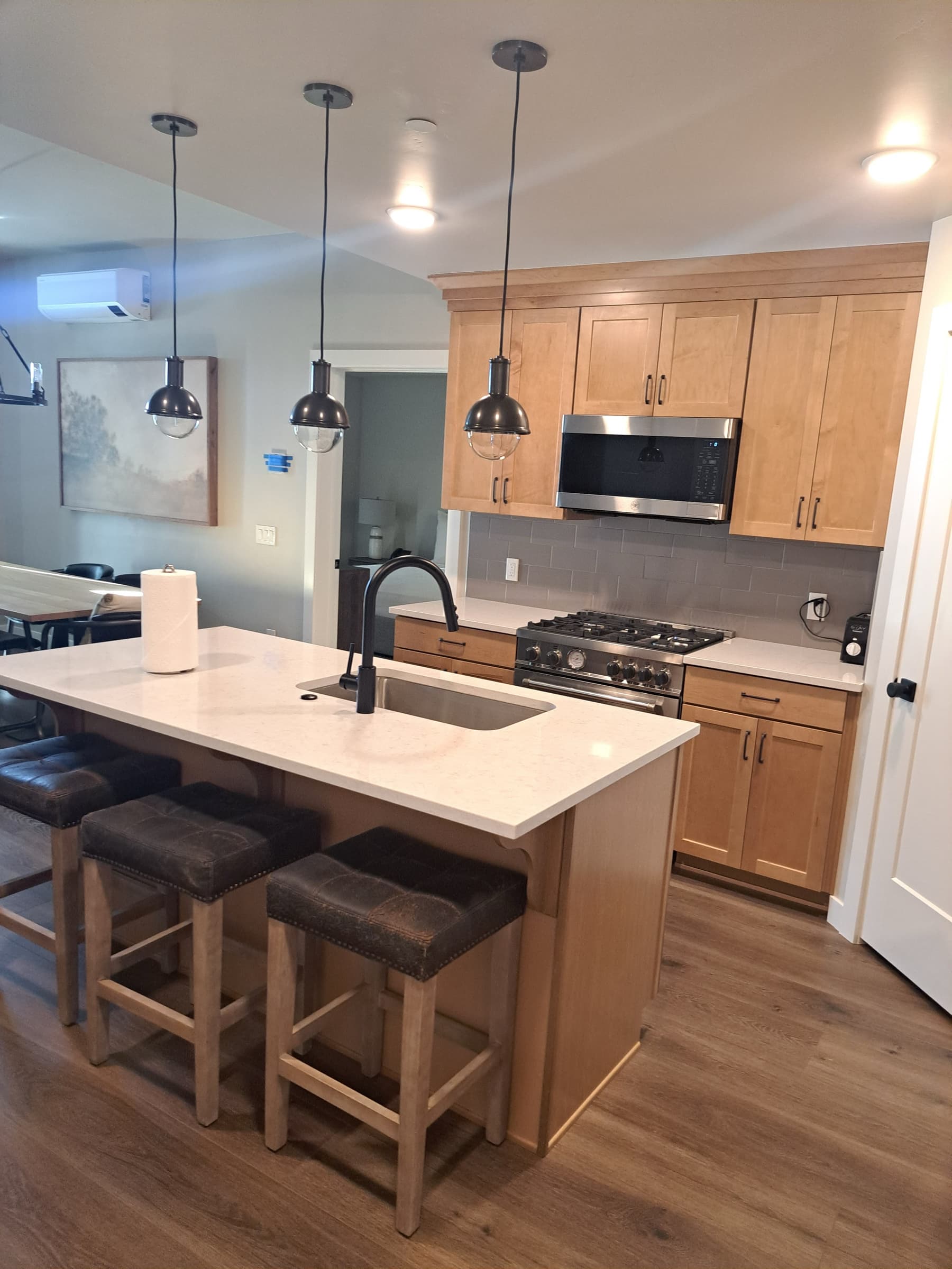 Park City kitchen remodel with oak cabinets and white quartz island