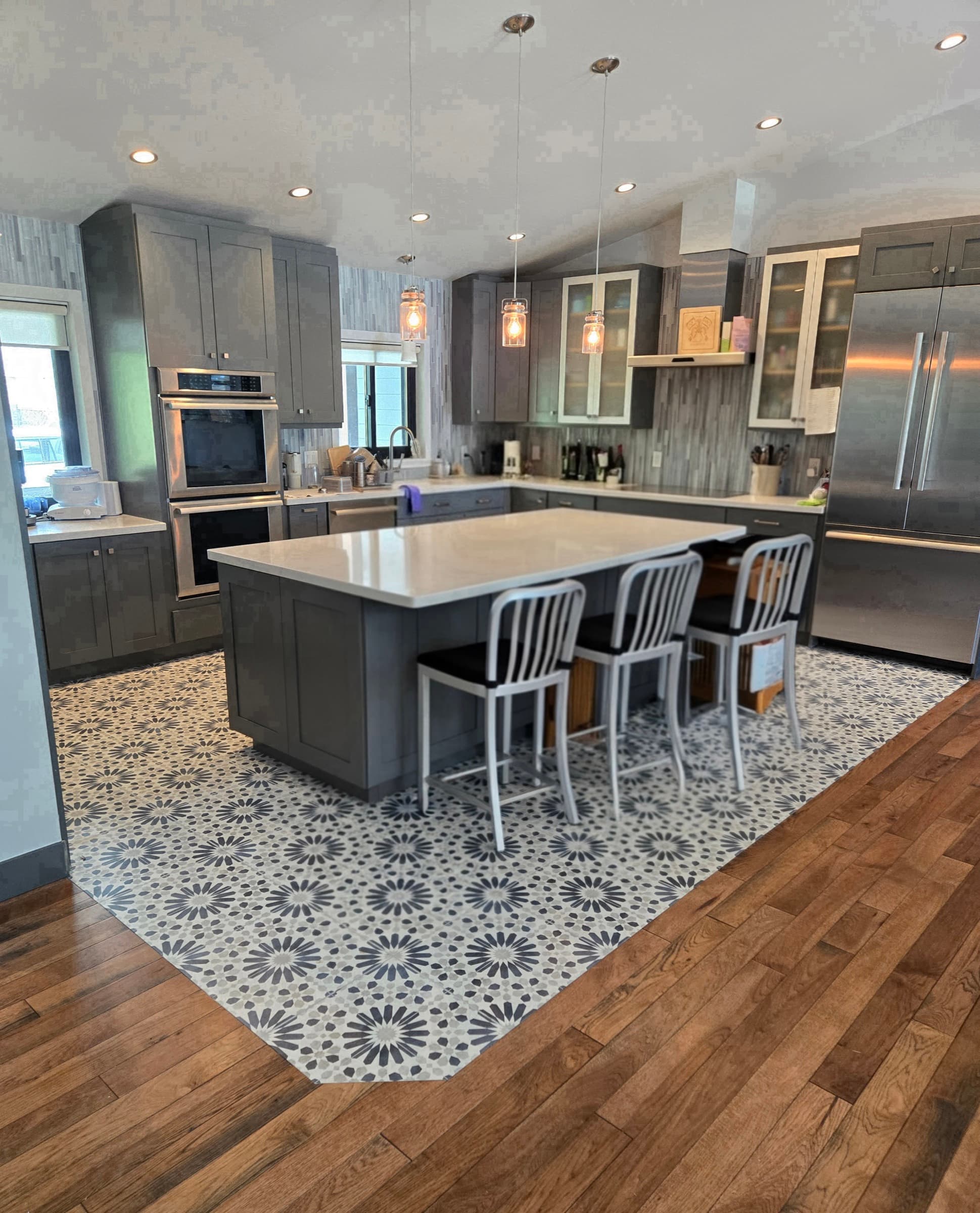 Park City kitchen remodel with grey cabinets and patterned tile inlay